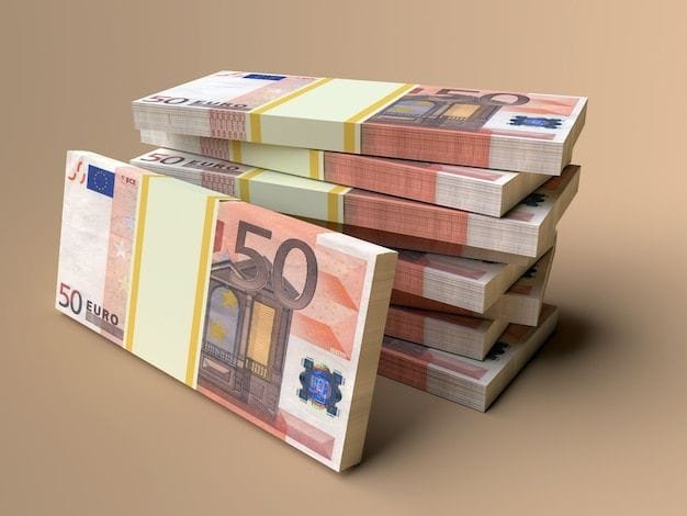 Close-up stack of Euro bills in various denominations.