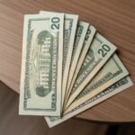 Stack of counterfeit $20 bills displayed for online sale with undetectable features