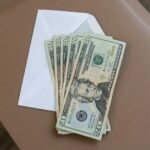 Close-up of fake US currency showing $20 bills available for purchase on dark web