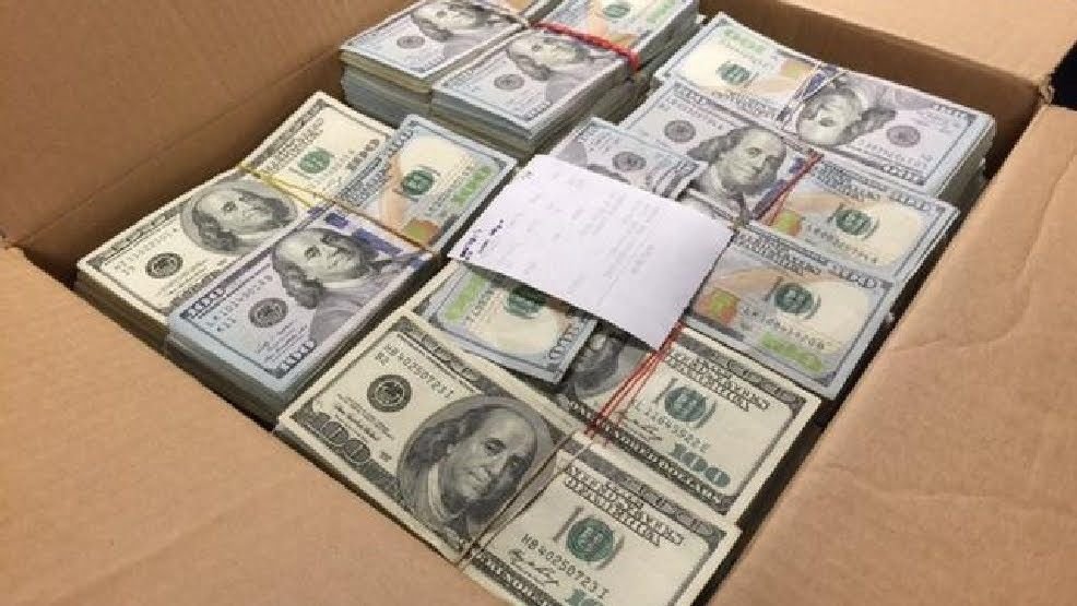 Prop money stack of US one hundred dollar bills.